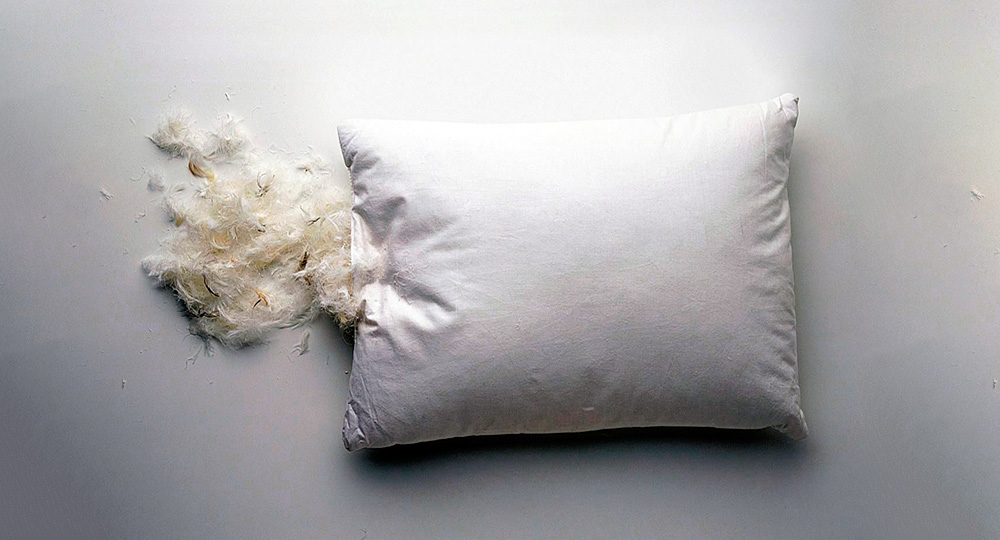 Можно ли постирать перьевую подушку дома?